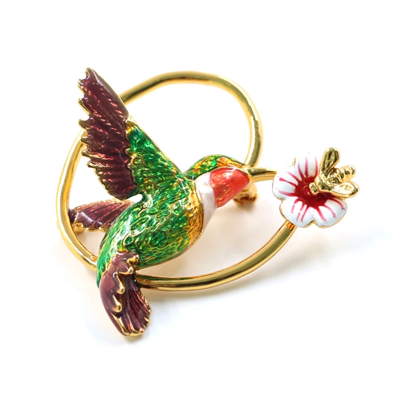 Esmalte de pássaro e broche de flor